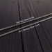 three different types of silver chains laid out on a wooden surface.