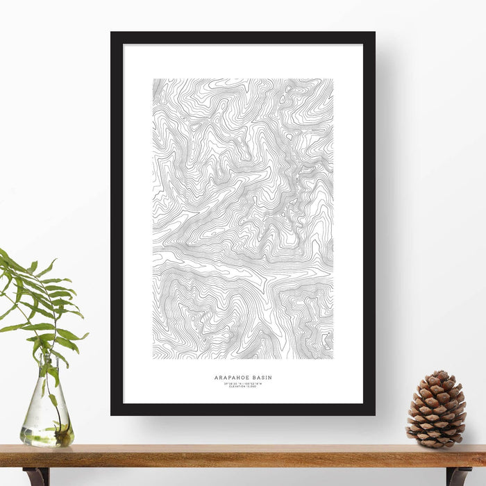 Topographic ski map art of Araphahoe Basin, Colorado with a black frame. 