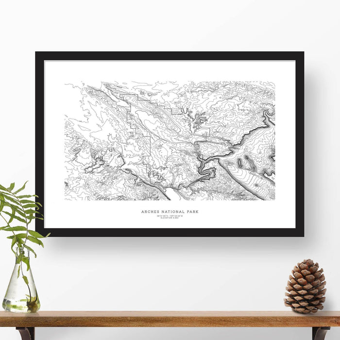 Framed travel art of Arches National Park, featuring topography map art in black and white.