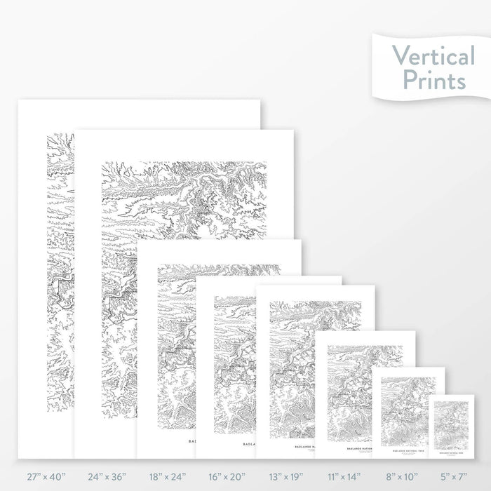 Available sizes for Badlands National Park topographic maps. 5x7, 8x10, 11x14, 16x20, 18x24, 24x36, and 27x40 posters shown. as black and white prints on a gray background.
