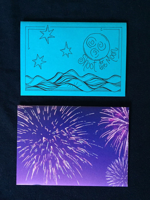 Card features design of the night sky above water along with the words shoot for the moon. Envelope features photograph of fireworks.