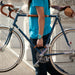 Person holding bike by leather handle installed between the down tube and seat tube