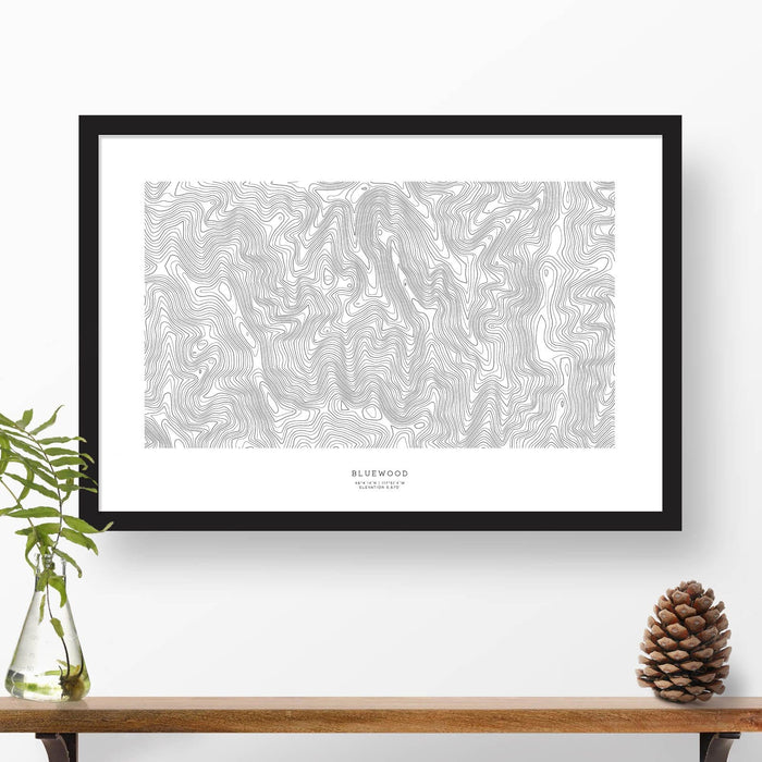 Framed black and white print of Bluewood ski area topography art. Text can be added to create a custom map poster as a travel gift.