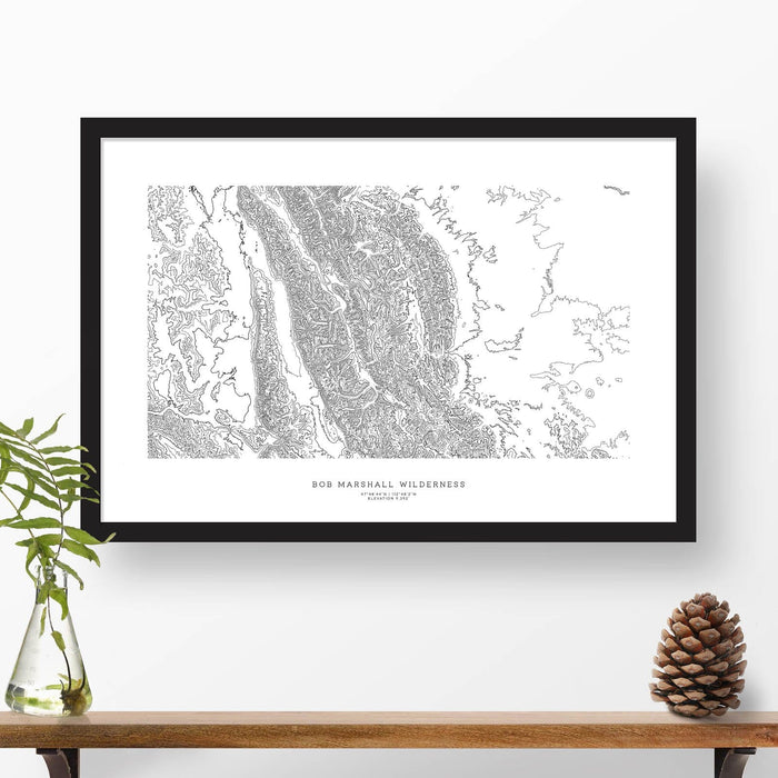 Framed black and white print of Bob Marshall Wilderness with topography art.