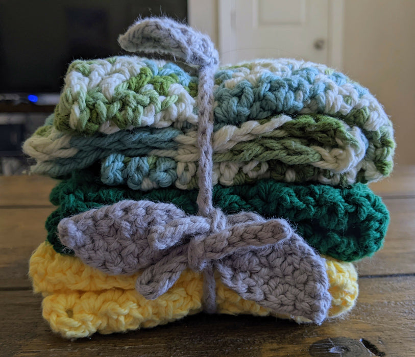 Photograph of the kitchen towels folded up, stacked on top of each other, and tied together.
