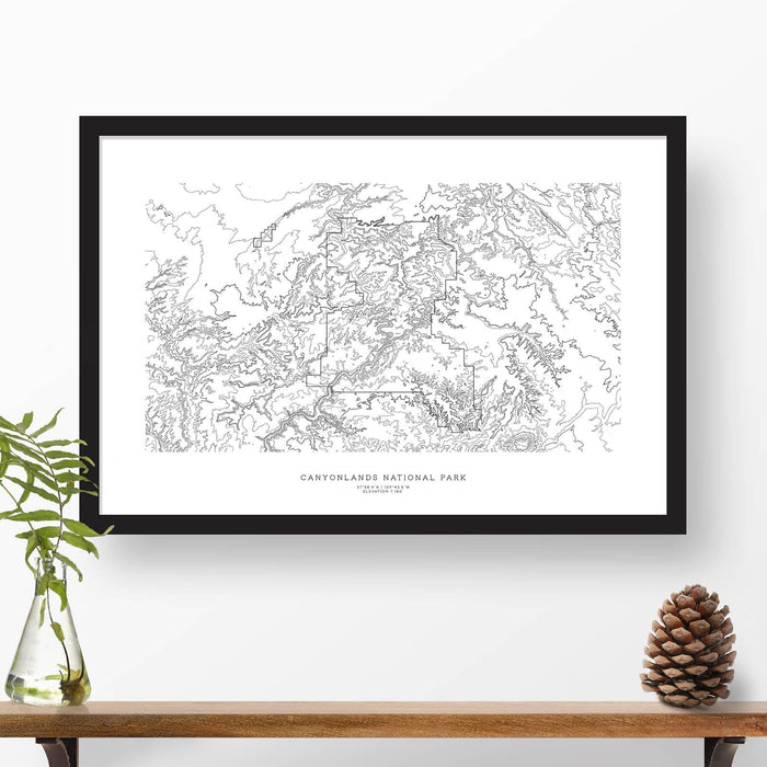 Framed black and white print of Canyonlands National Park topography art. Text can be added to create a custom map poster as a travel gift.