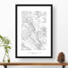 National park print of Capitol Reef with black and white topography in a black 24x36 vertical frame.