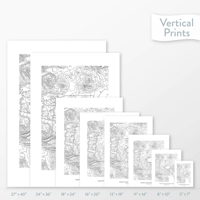 Available sizes for Crater Lake National Park topographic maps. 5x7, 8x10, 11x14, 16x20, 18x24, 24x36, and 27x40 posters shown. as black and white prints on a gray background.