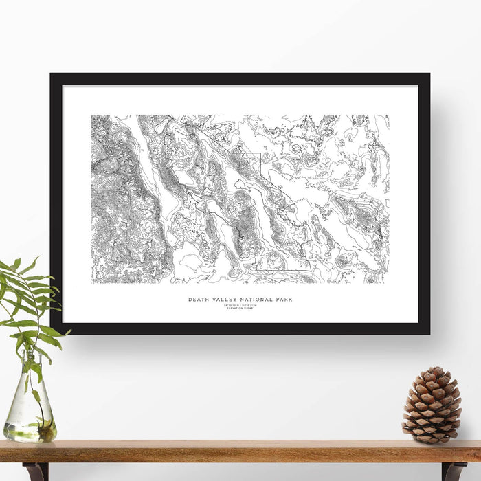 Framed black and white print of Death Valley National Park topography art. Text can be added to create a custom map poster as a travel gift.