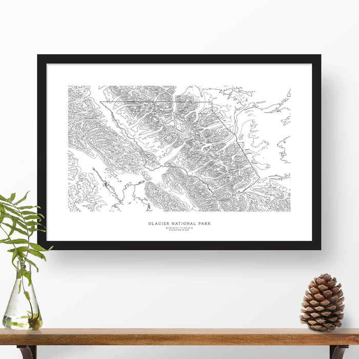 Framed travel art of Glacier National Park, featuring topography map art in black and white.