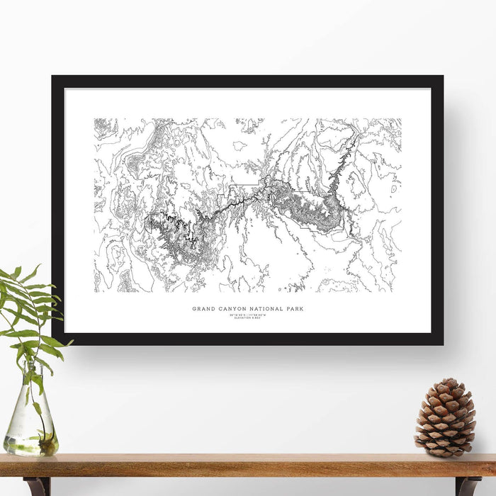Framed black and white print of Grand Canyon National Park topography art. Text can be added to create a custom map poster as a travel gift.