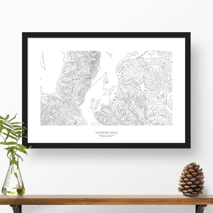 Framed black and white print of Jackson Hole, Wyoming  topography art. Text can be added to create a custom map poster as a travel gift.