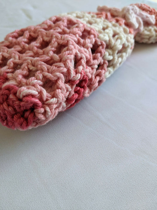 Close-up photograph of the pink and brown bag.