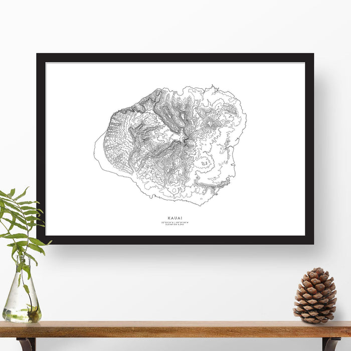 Framed travel art of Kauai, Hawaii, featuring topography map art in black and white.