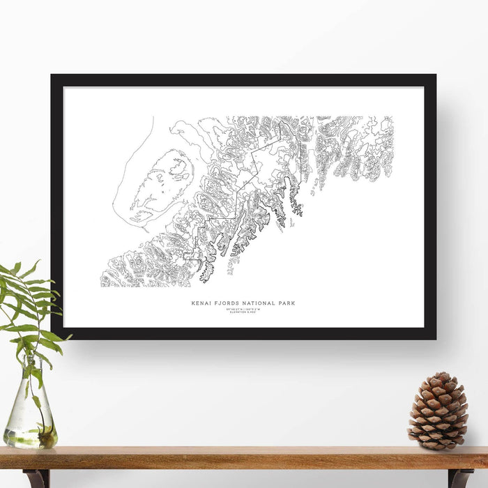 Framed black and white print of Kenai Fjords National Park topography art. Text can be added to create a custom map poster as a travel gift.