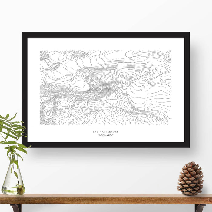Framed travel art of the Matterhorn, Switzerland, featuring topography map art in black and white.