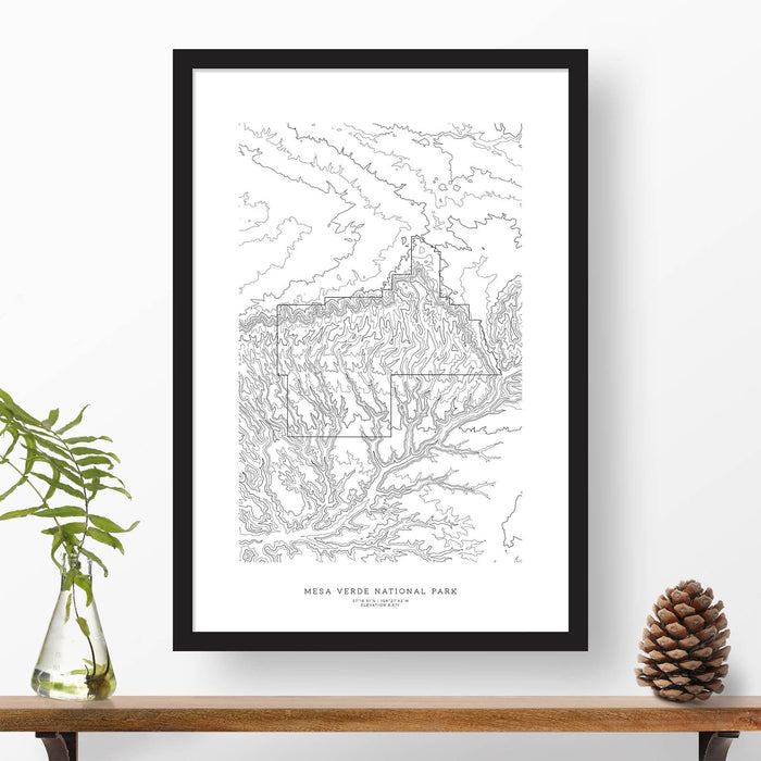 Black and white map and travel art of Mesa Verde National Park. Topography contours are in black on a white background. Text below the image can be personalized for a perfect custom map art gift idea.