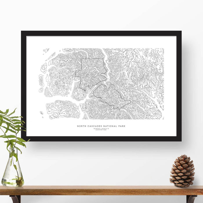 Framed travel art of North Cascades National Park, featuring topography map art in black and white.