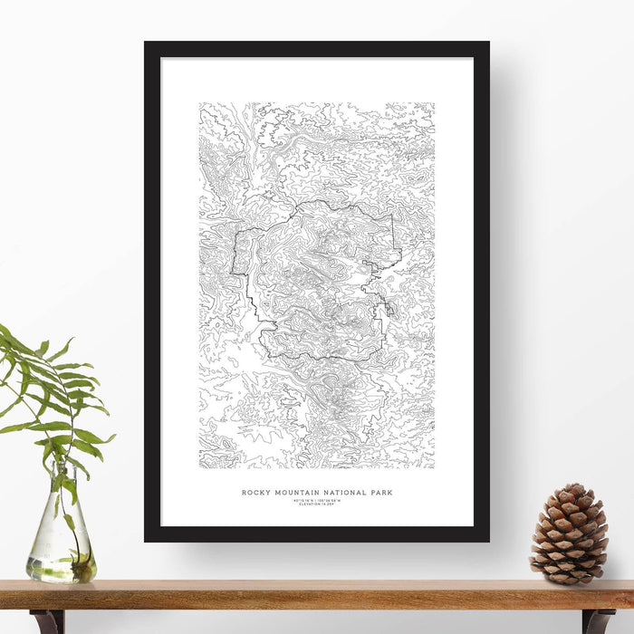 National park print of Rocky Mountain National Park with black and white topography in a black 24x36 vertical frame.