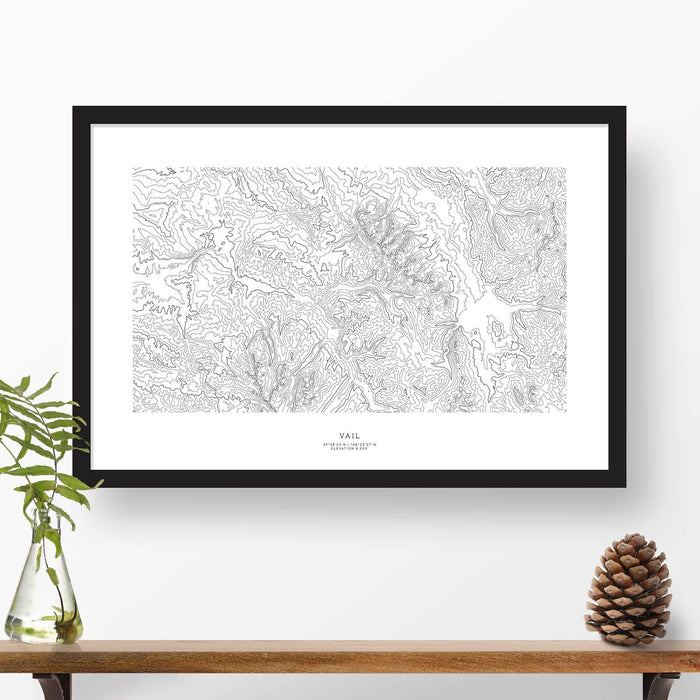 Framed black and white print of Vail, Colorado topography art. Text can be added to create a custom map poster as a travel gift.