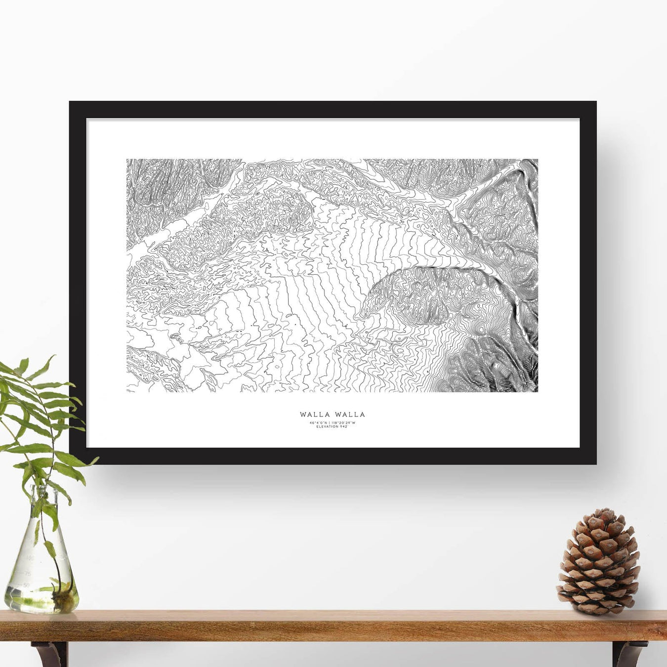 Framed black and white print of Walla Walla, Washington topography art. Text can be added to create a custom map poster as a travel gift.