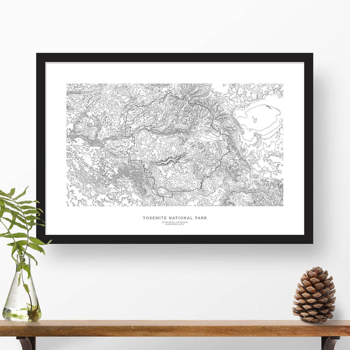 Framed black and white print of Yosemite National Park topography art. Text can be added to create a custom map poster as a travel gift.