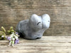 Ceramic raku bear kami sculpture glazed in pale grey-blue. It has a kind, gentle face.