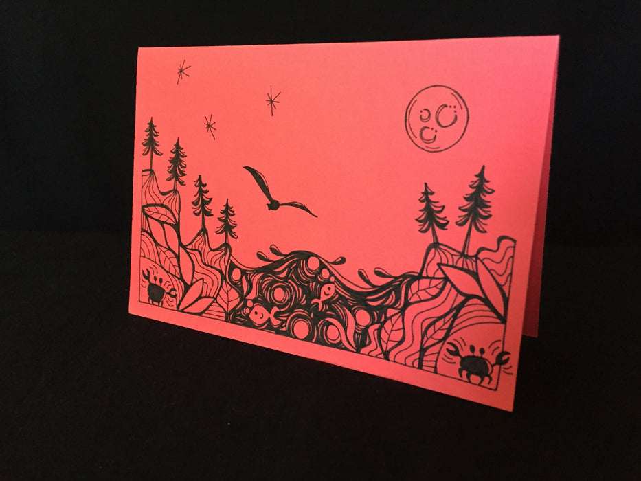Card features evening nature scene with trees, fish, a seagull, and corner crabs on salmon-colored paper.