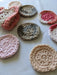 Close-up photograph of the pink and brown face scrubbies.