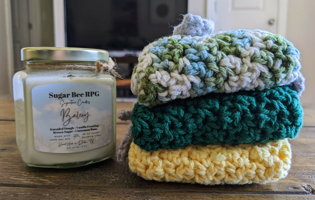 Photograph of the stacked kitchen towels next to a candle, for scale.
