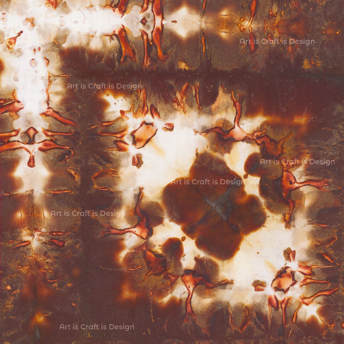 pear chroamtogram print with bursts of brown tinged with reddish-pink running along the top and left side of the print with blotches of the same color in the center, watermarks throughout the image