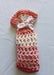 Photograph of the pink and brown face scrubbies bag.