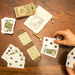 Playing a game of travel cribbage with Bicycle Eco cards on walnut table