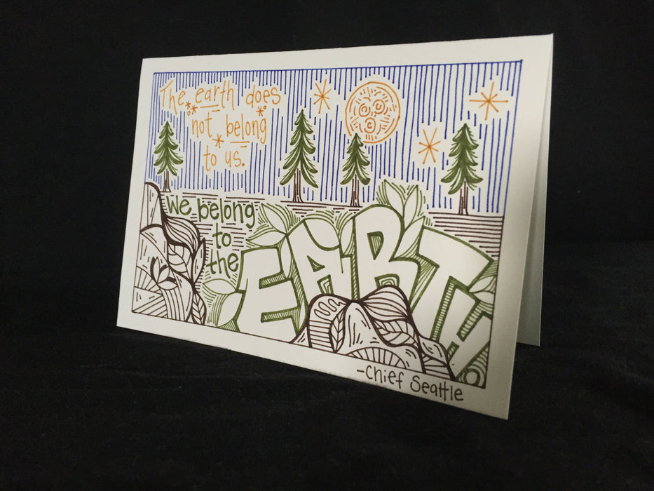 Card features an evening nature scene with Chief Seattle's words, The earth does not belong to us. We belong to the earth.