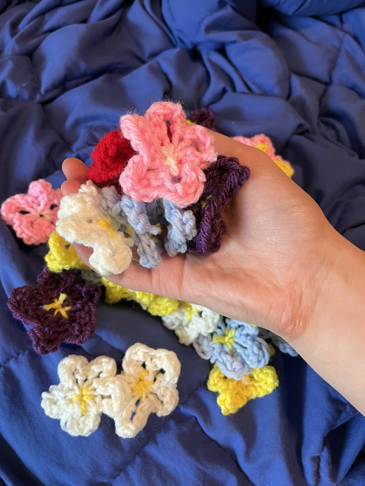 Tiny knitted flowers