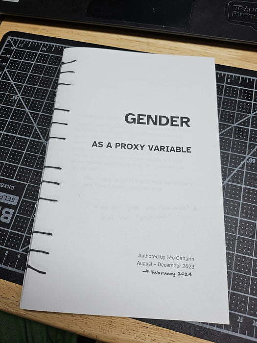 the front of a paper zine that reads 'gender as a proxy variable' and 'authored by Lee Cattarin, August - December 2023 -> February 2024'. It was photocopied from an original with a handstitched binding