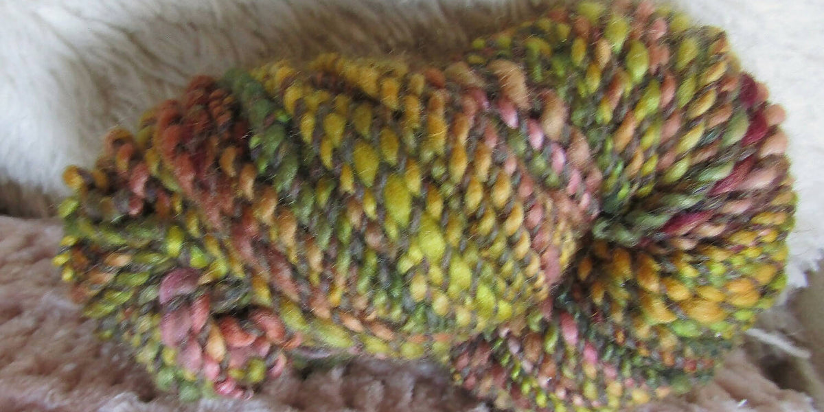 163 yds, bulky handspun yarn, 2 ply with outlet wrapped locks, 'Trapped No. 1'