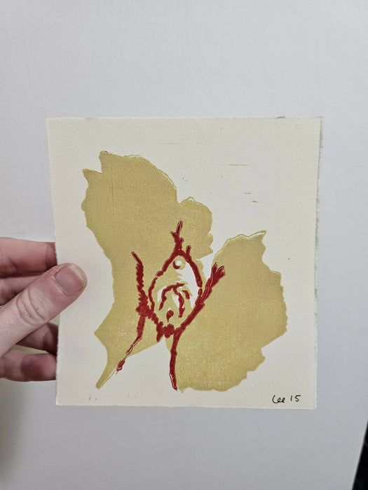 Dick print in cornsilk (muted yellow) and red.