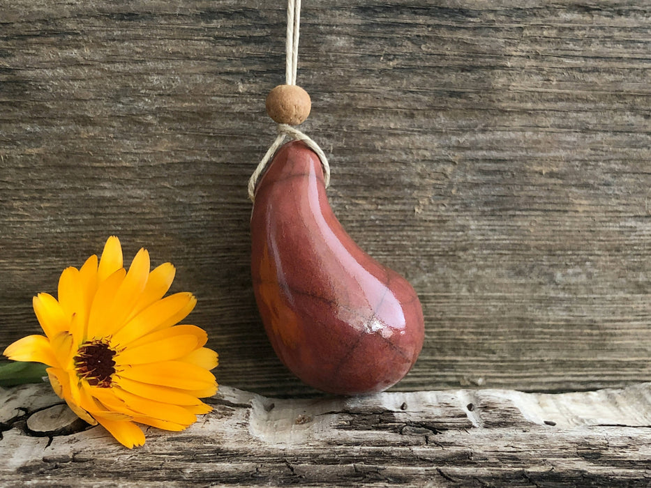 Calming worry pendant (red-orange) w/ sandalwood in raku ceramic