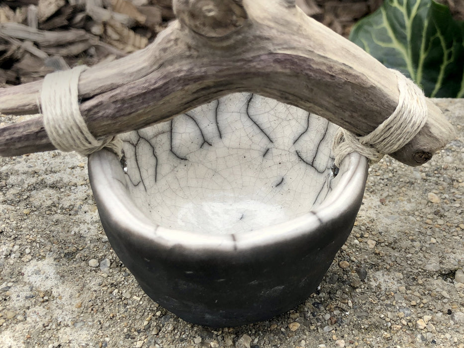 Raku ceramic and driftwood bucket sculpture