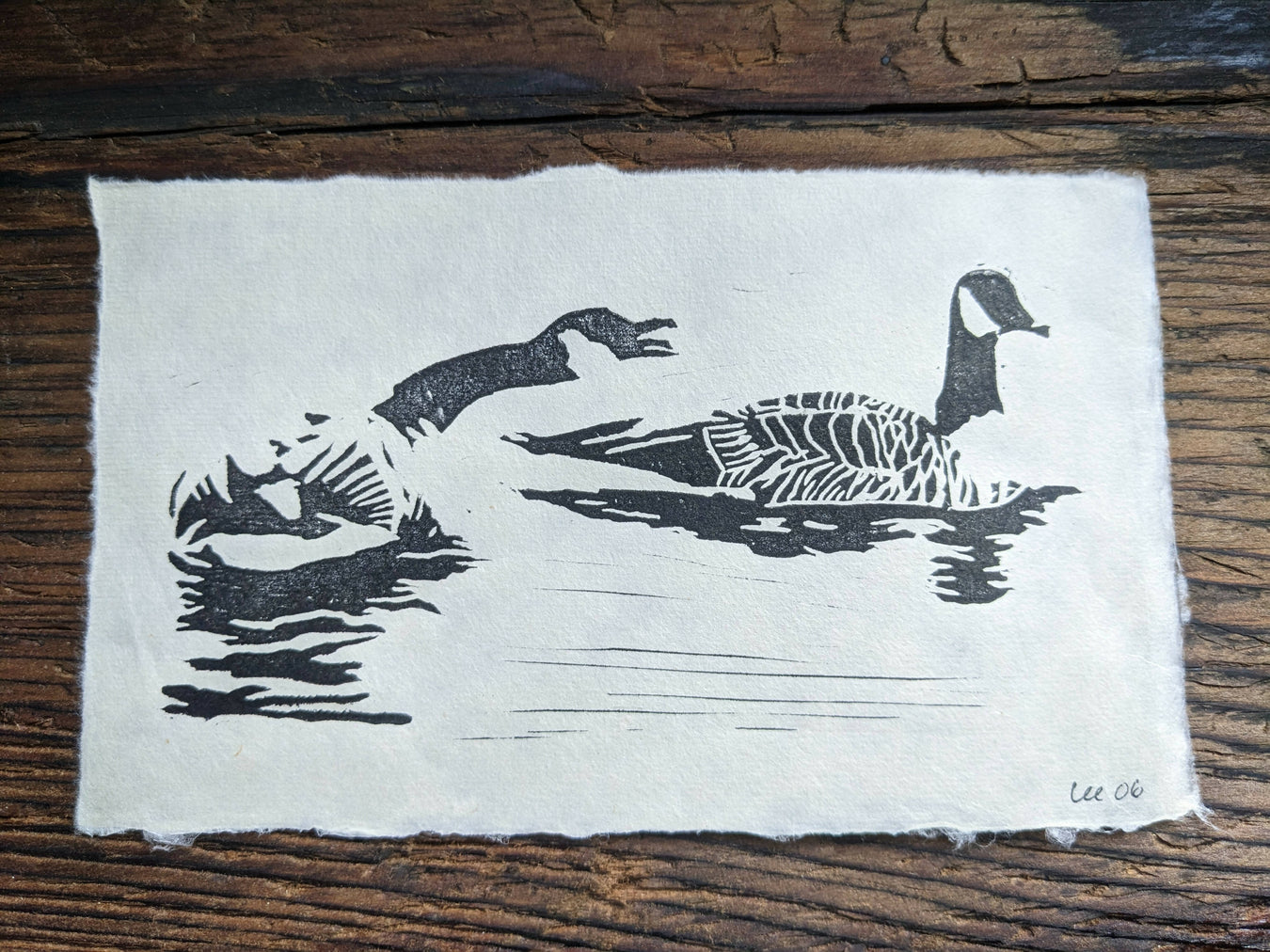 a print in black ink showing two geese, one honking at the other